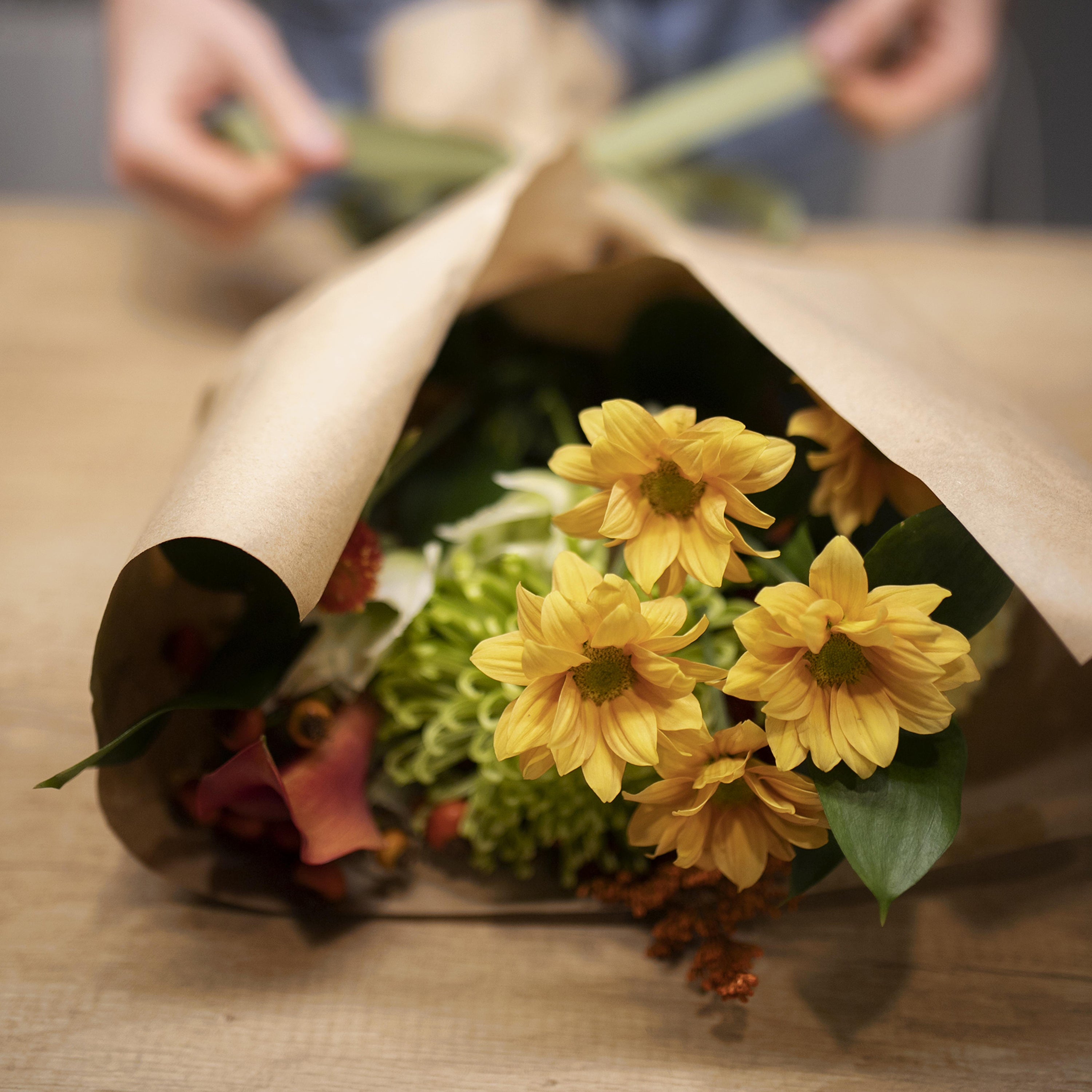 Florist arranging flower bouquet