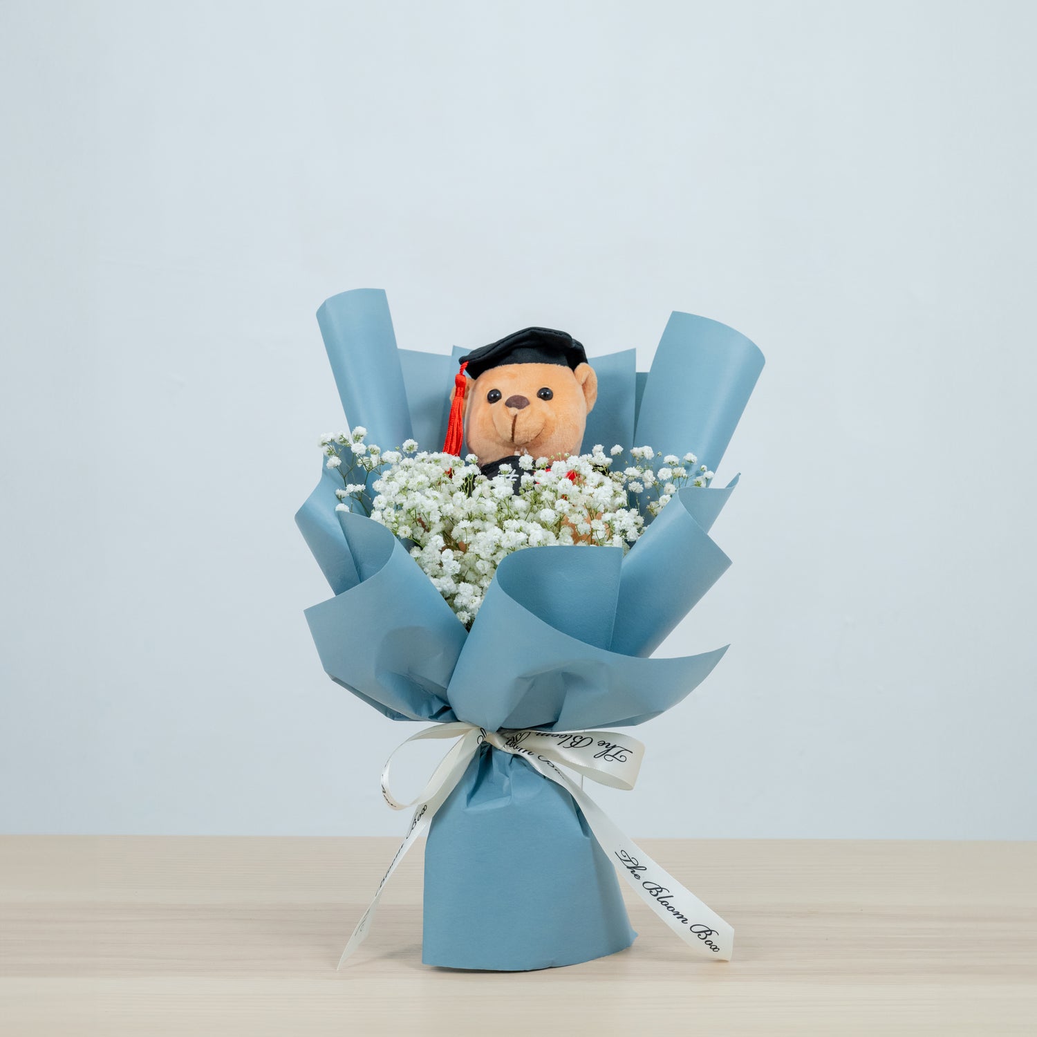 graduation bear bouquet with baby breath