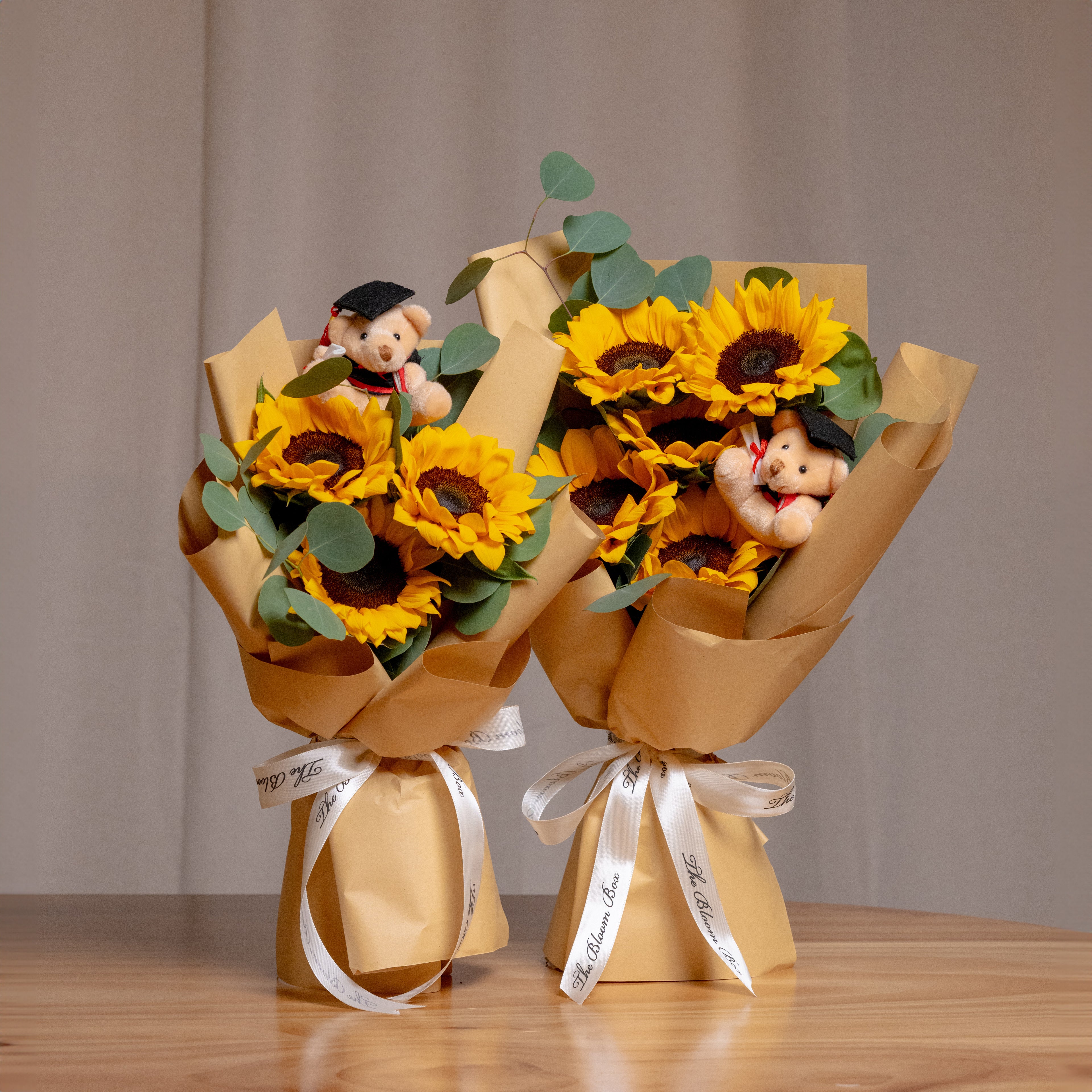 graduation bear sunflower bouquet in 3 stalks and 5 stalks side by side view