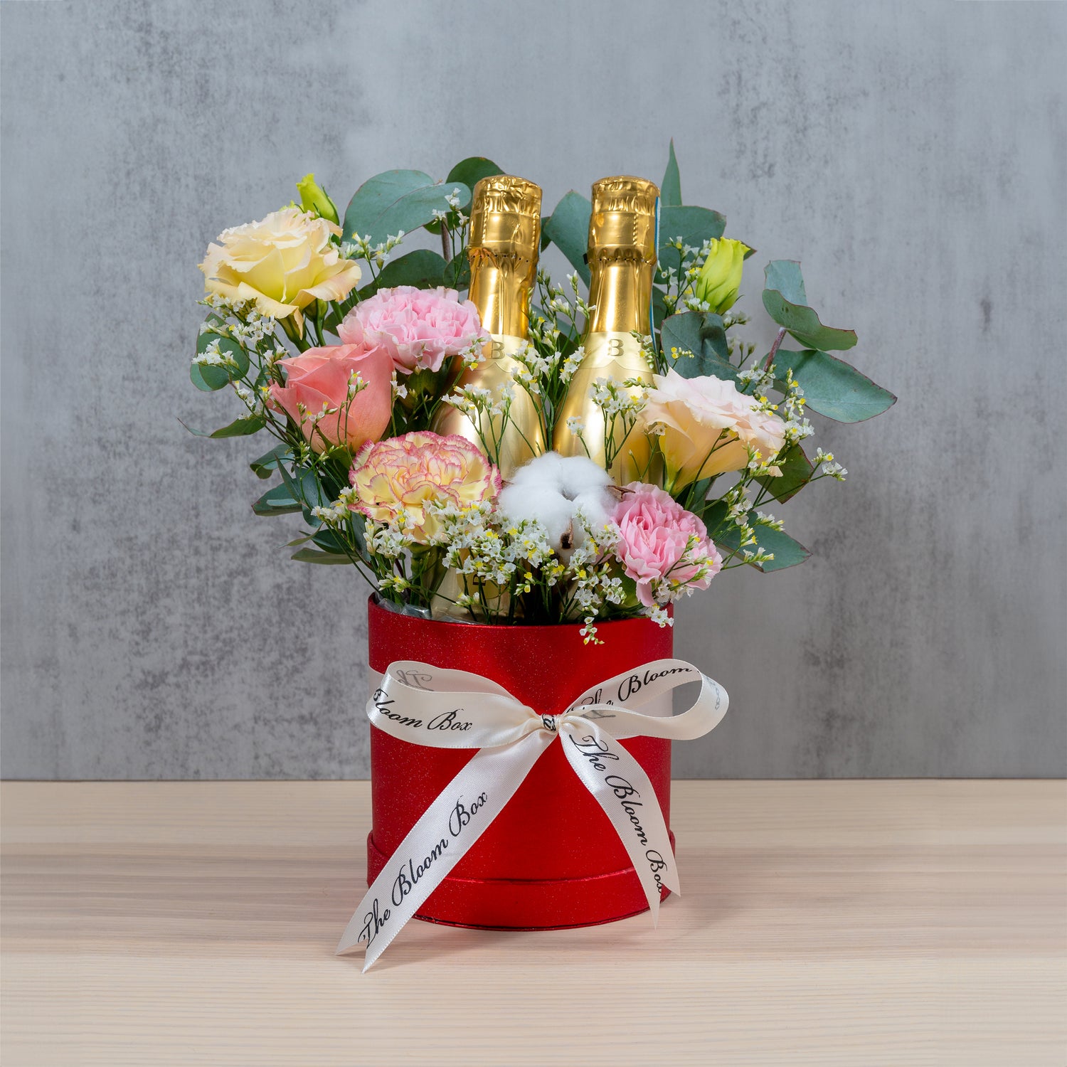 flower arrangement for congratulations with double champagne bottles