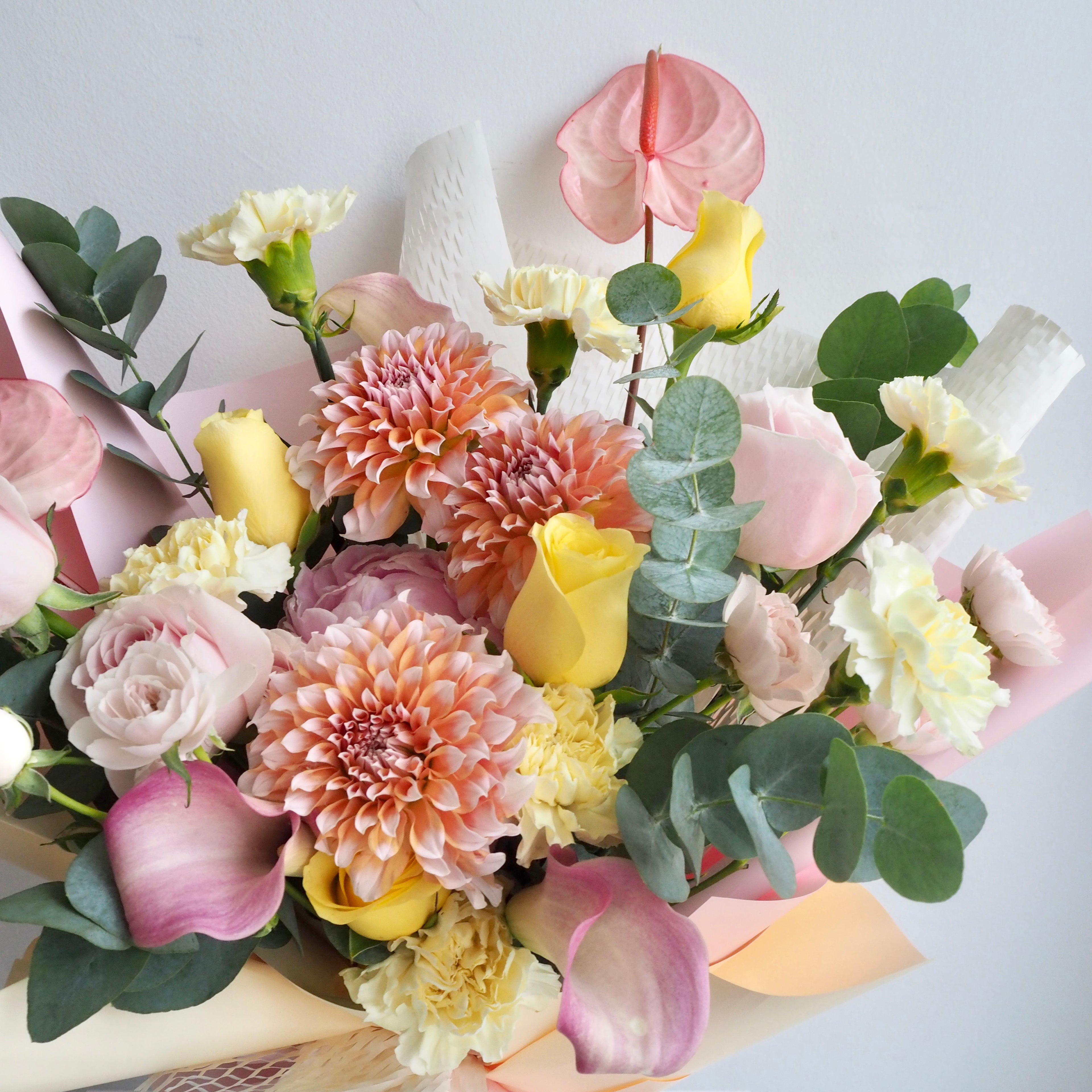 Close-up of premium fresh flowers in Sorbet bouquet with honeycomb wrapping