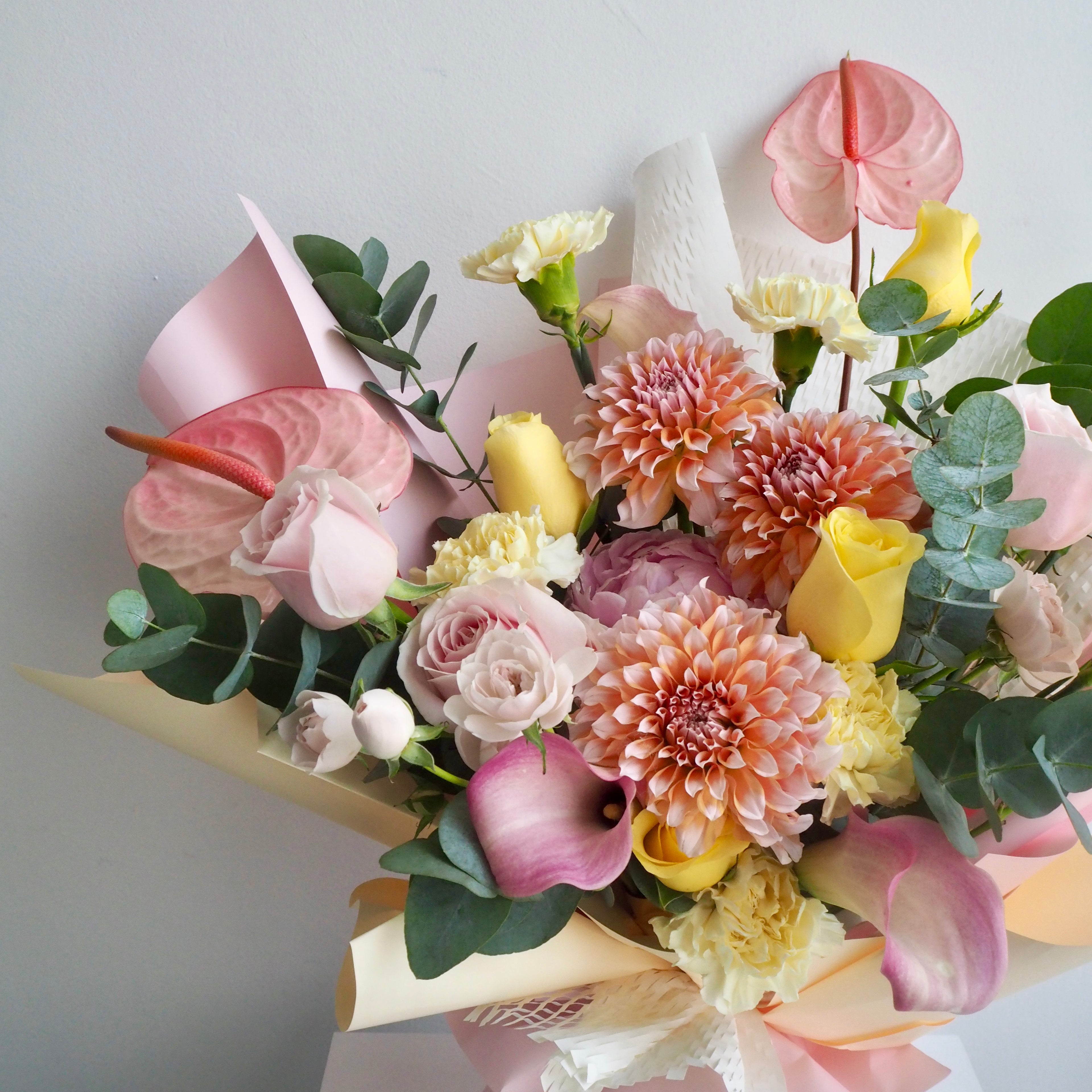 Sorbet luxury flower bouquet wrapped in pink and white paper, ready for same-day delivery in Singapore