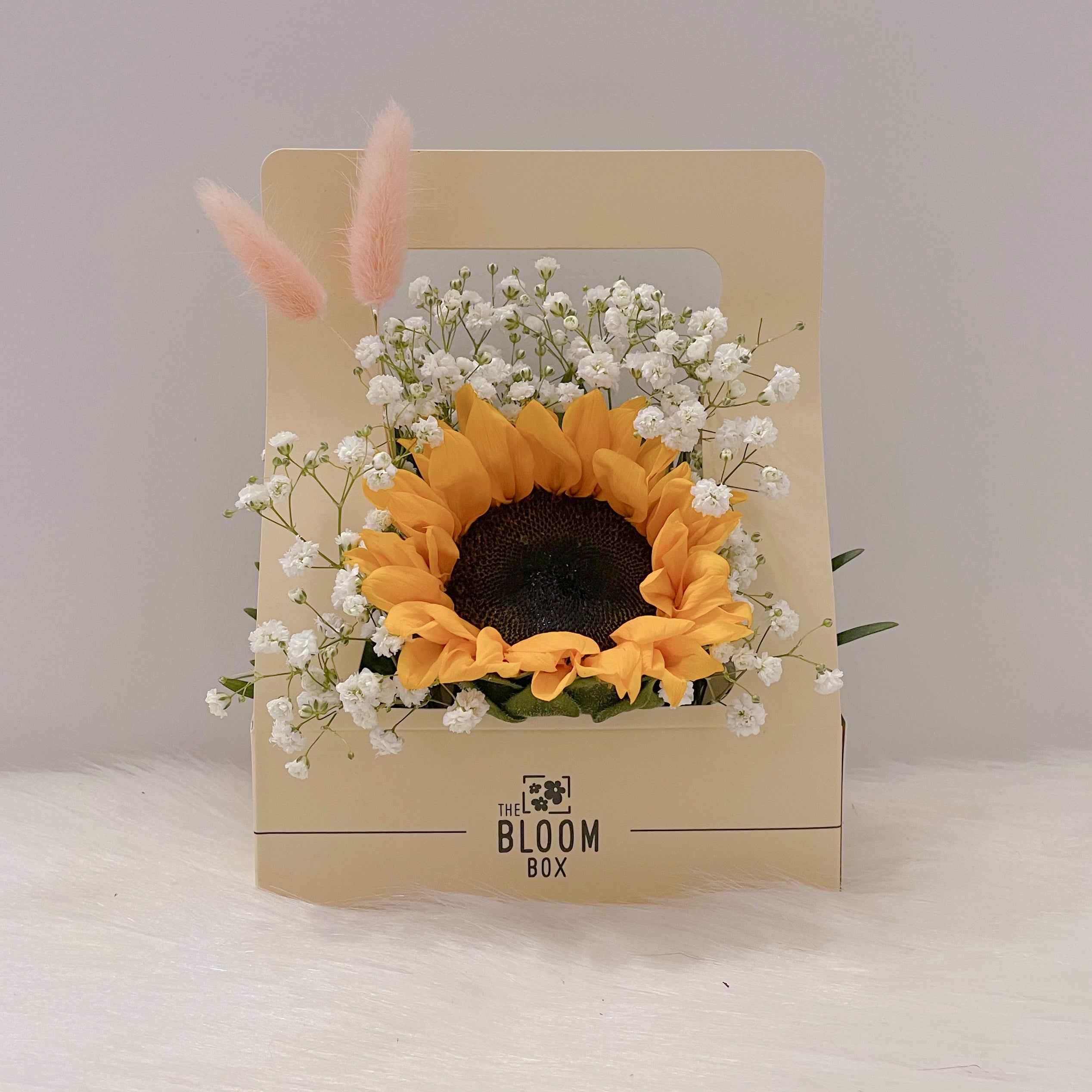 sunflower in centre surrounding with baby breath flowers