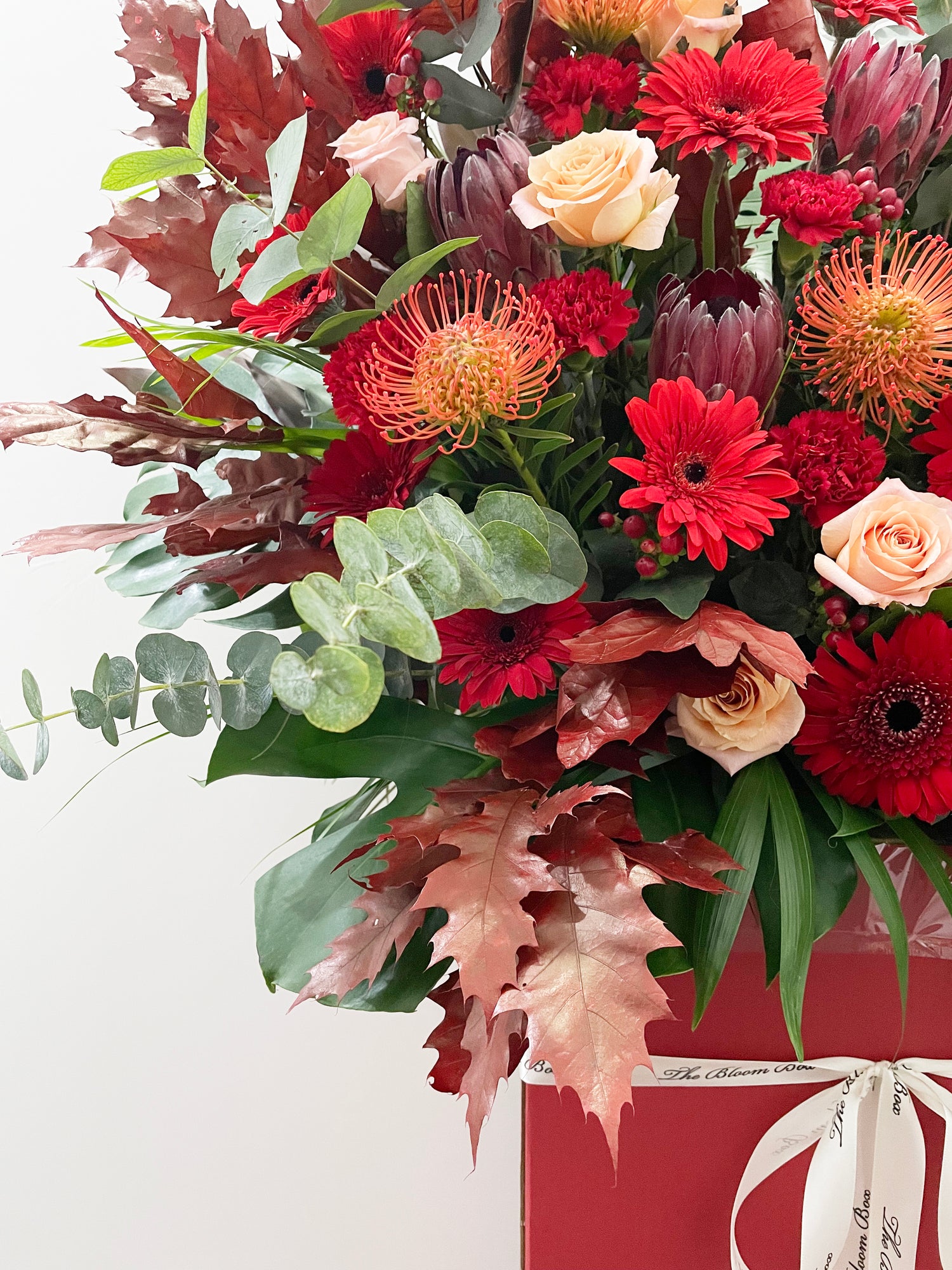 close up of congratulations flower stand with red flowers