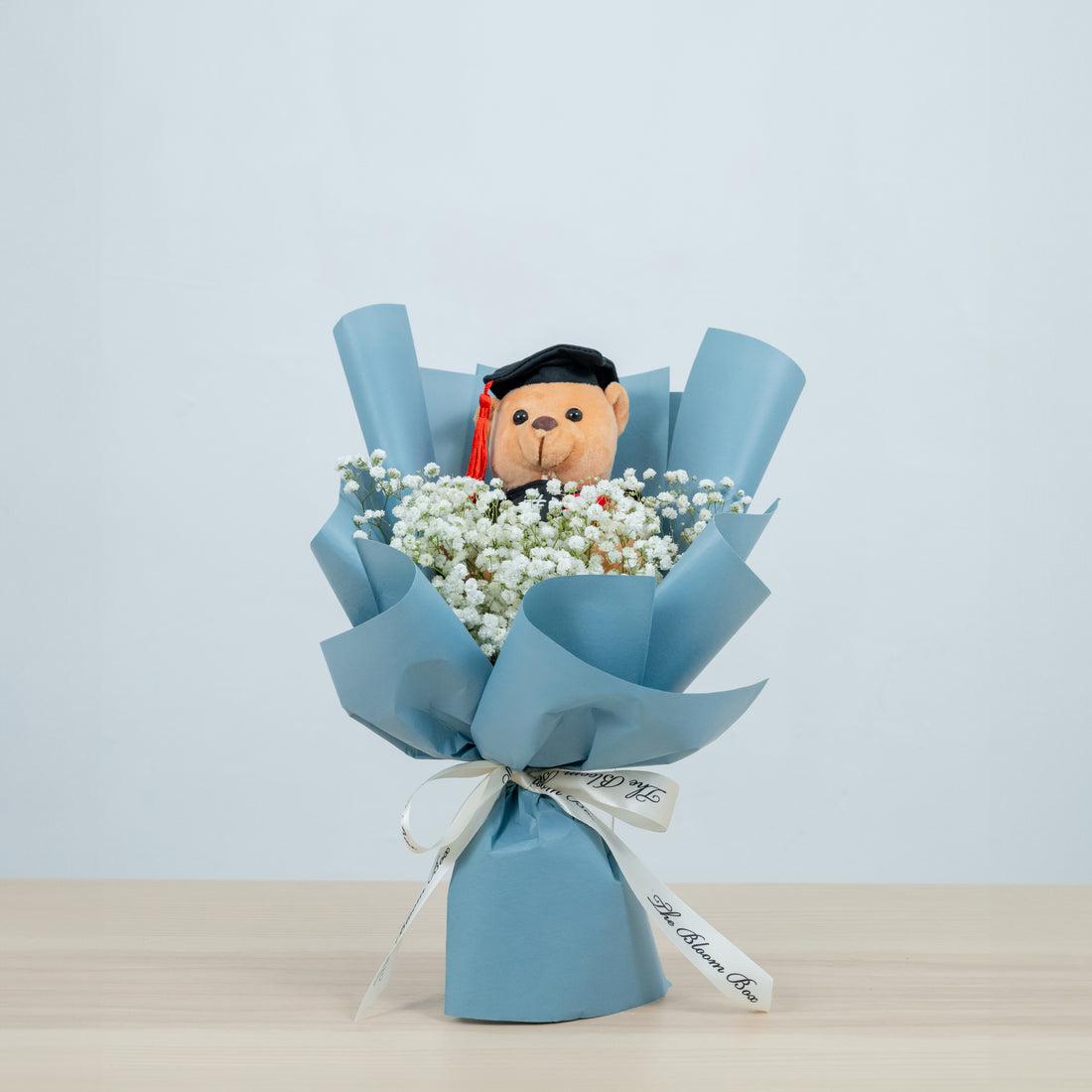 graduation bear bouquet with baby breath