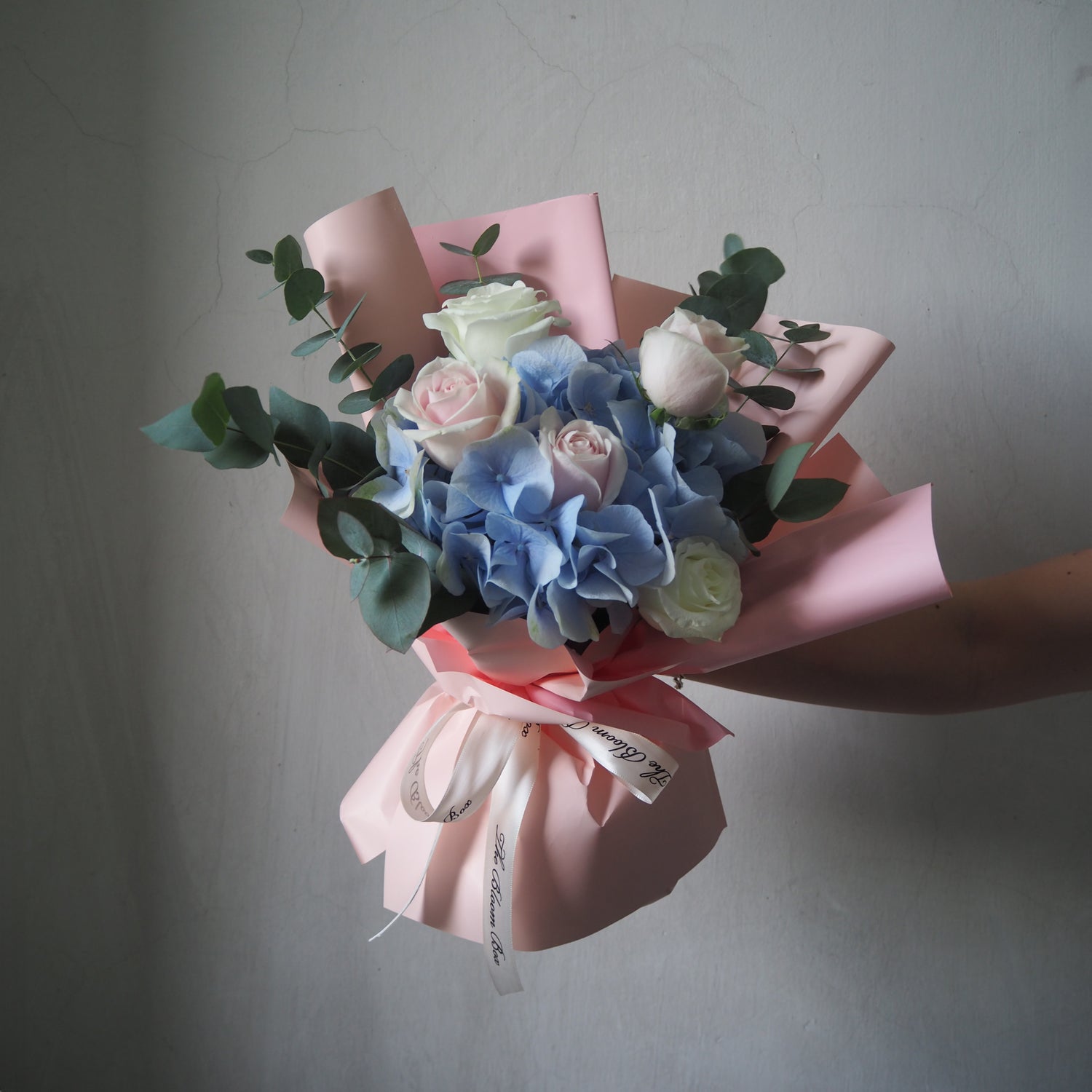 blue hydrangea and white pink roses bouquet