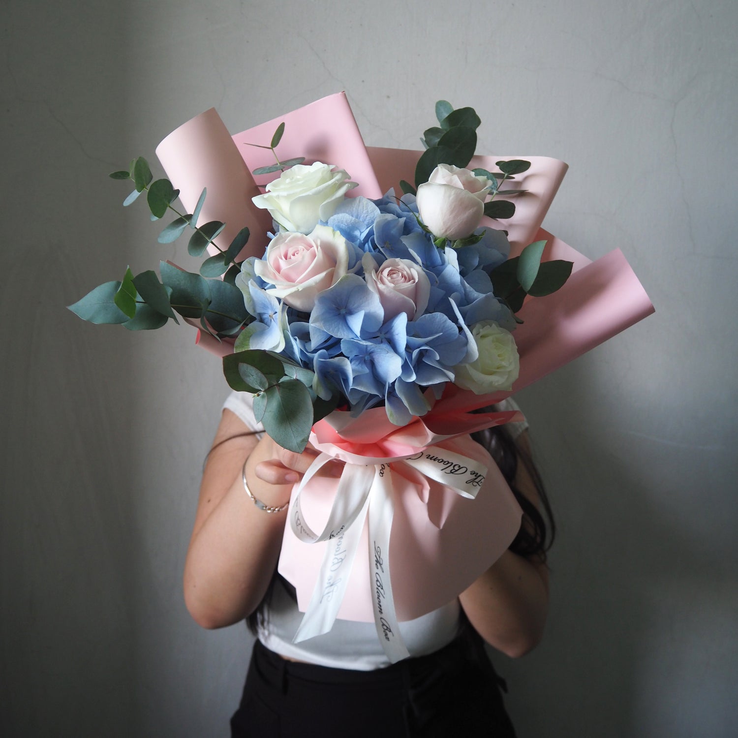 front view of hydrangea bouquet with roses