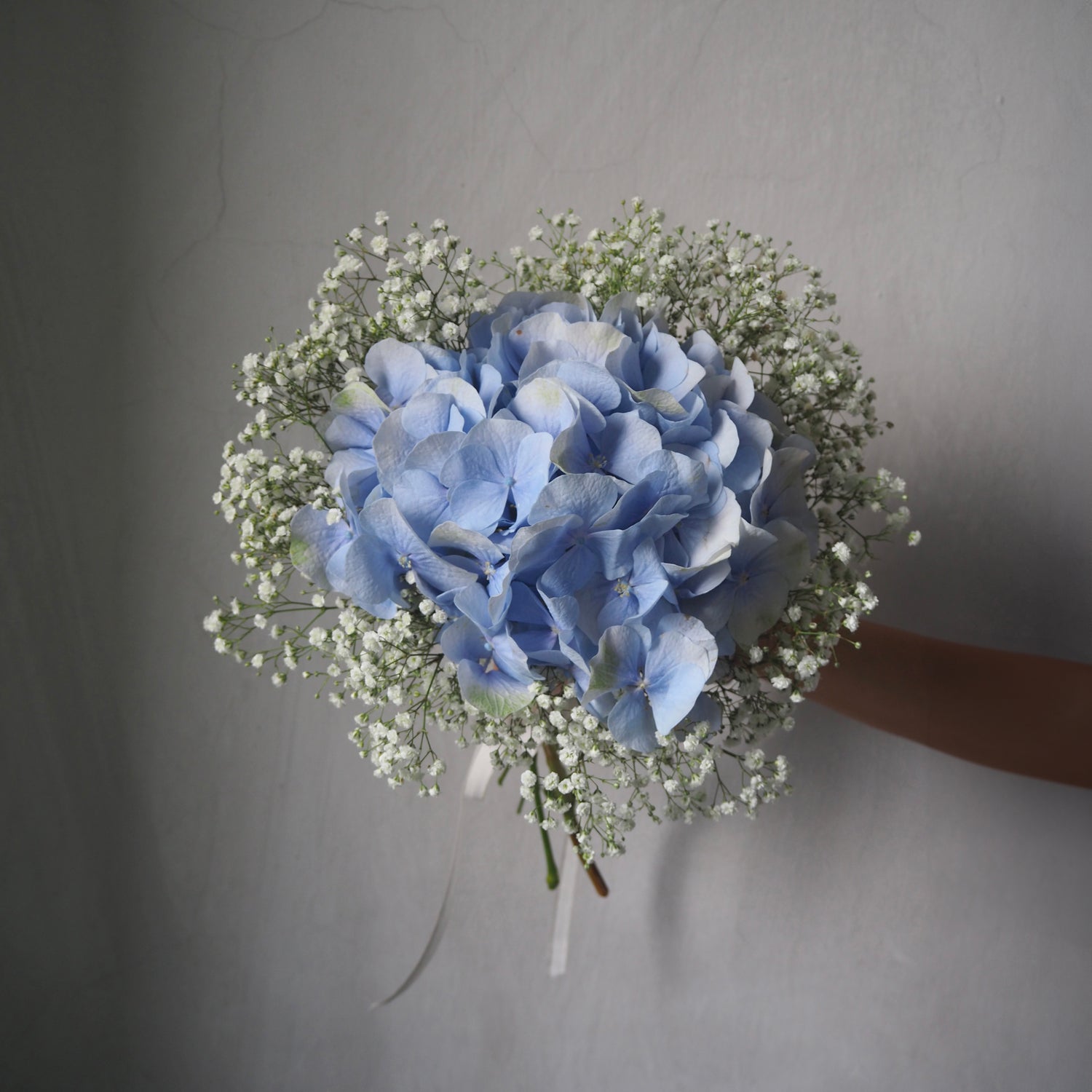 front view of bridal bouquet with hydrangea and baby&