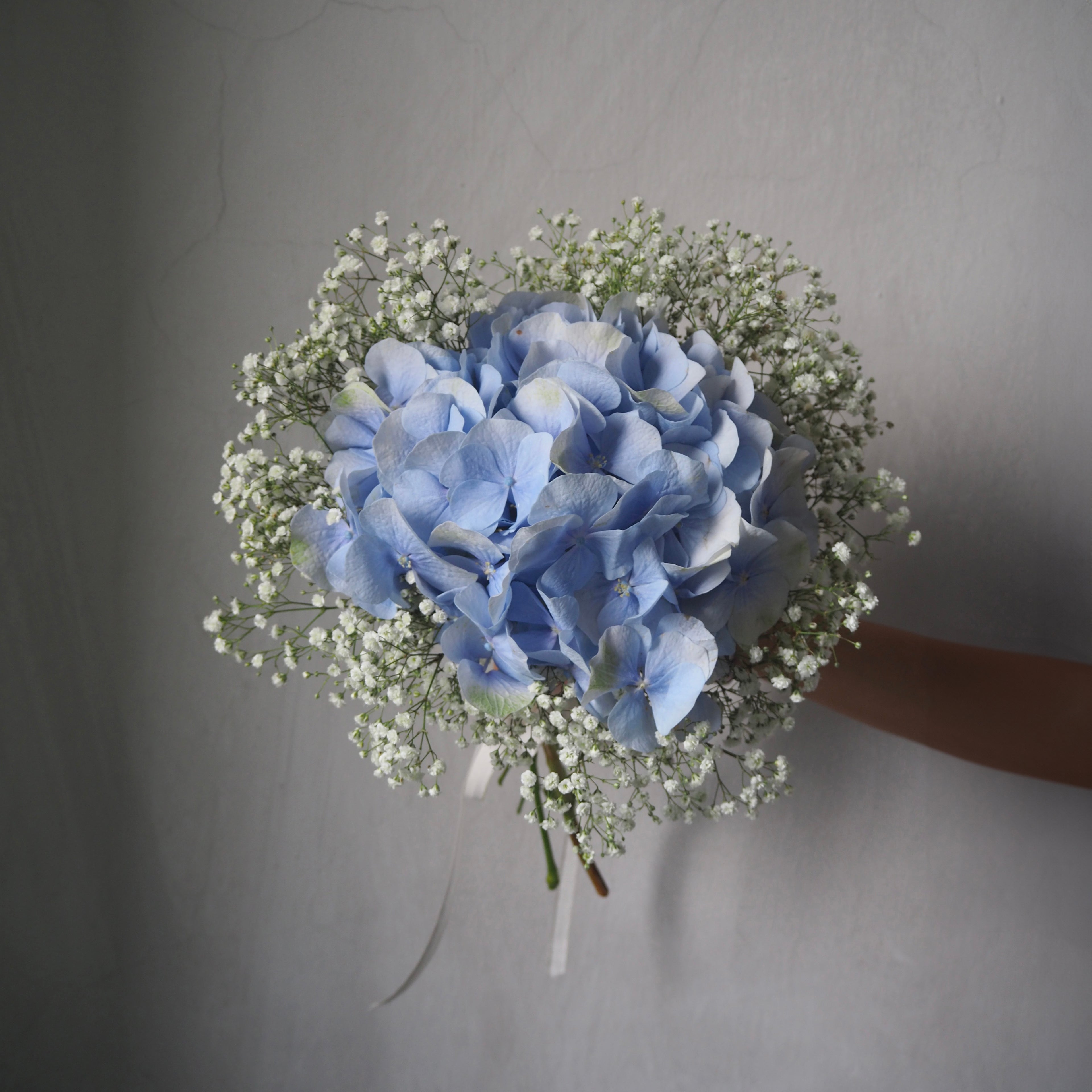 front view of bridal bouquet with hydrangea and baby&