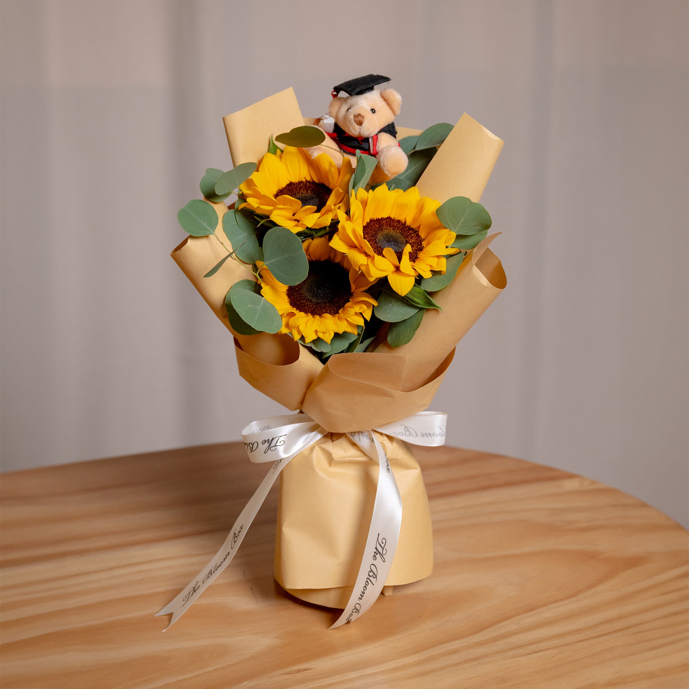 3 stalks of sunflower graduation bear bouquet