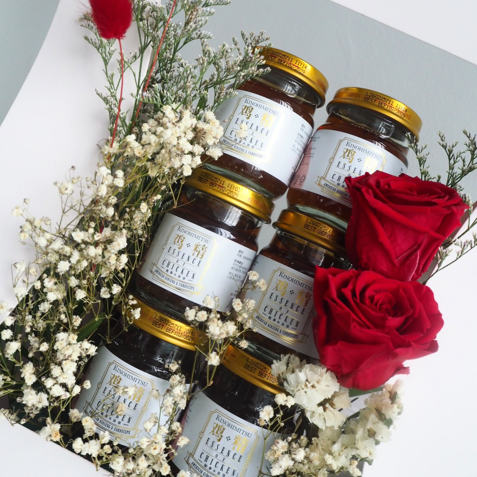 chicken essence box close up with preserved red roses