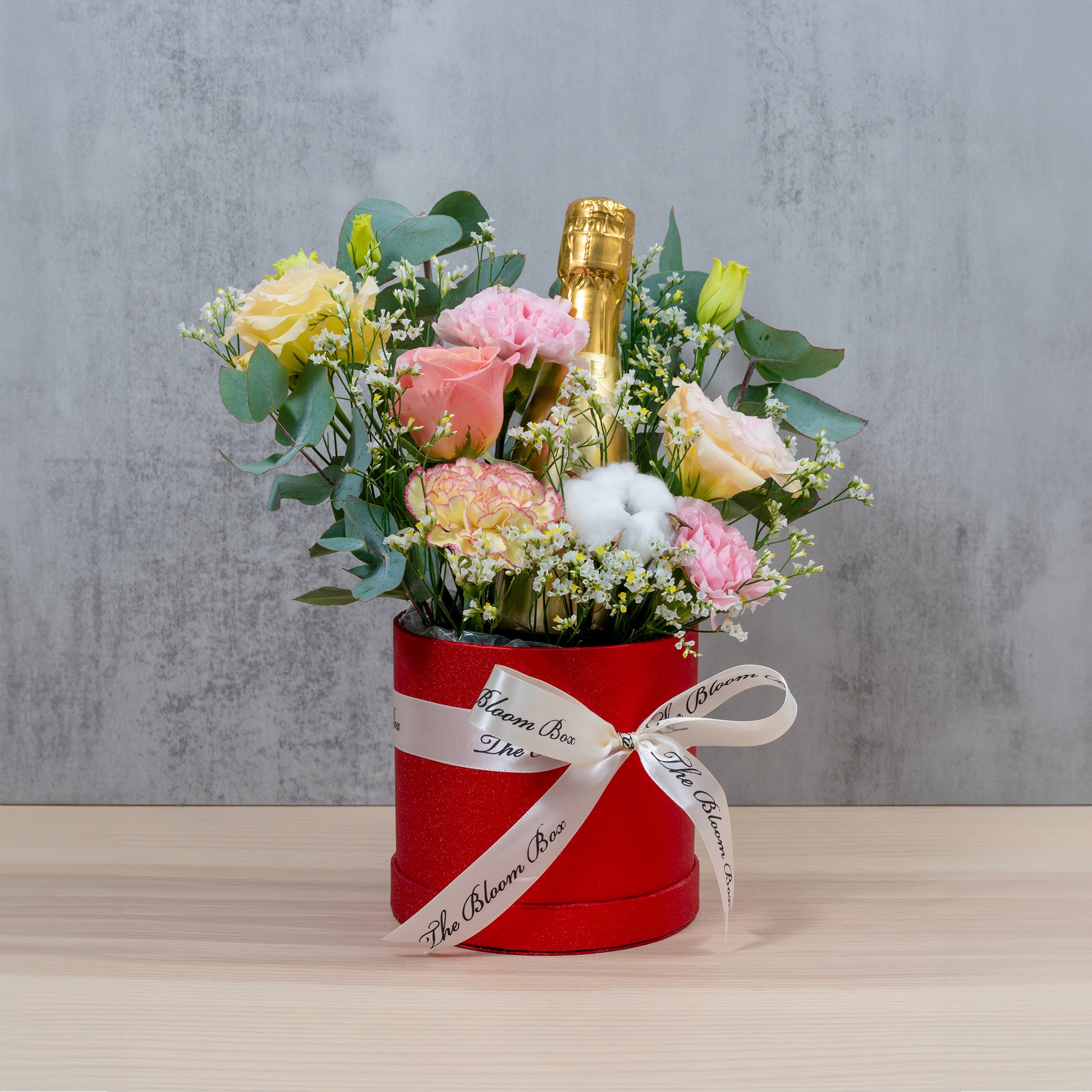 flower arrangement with champagne bottle single