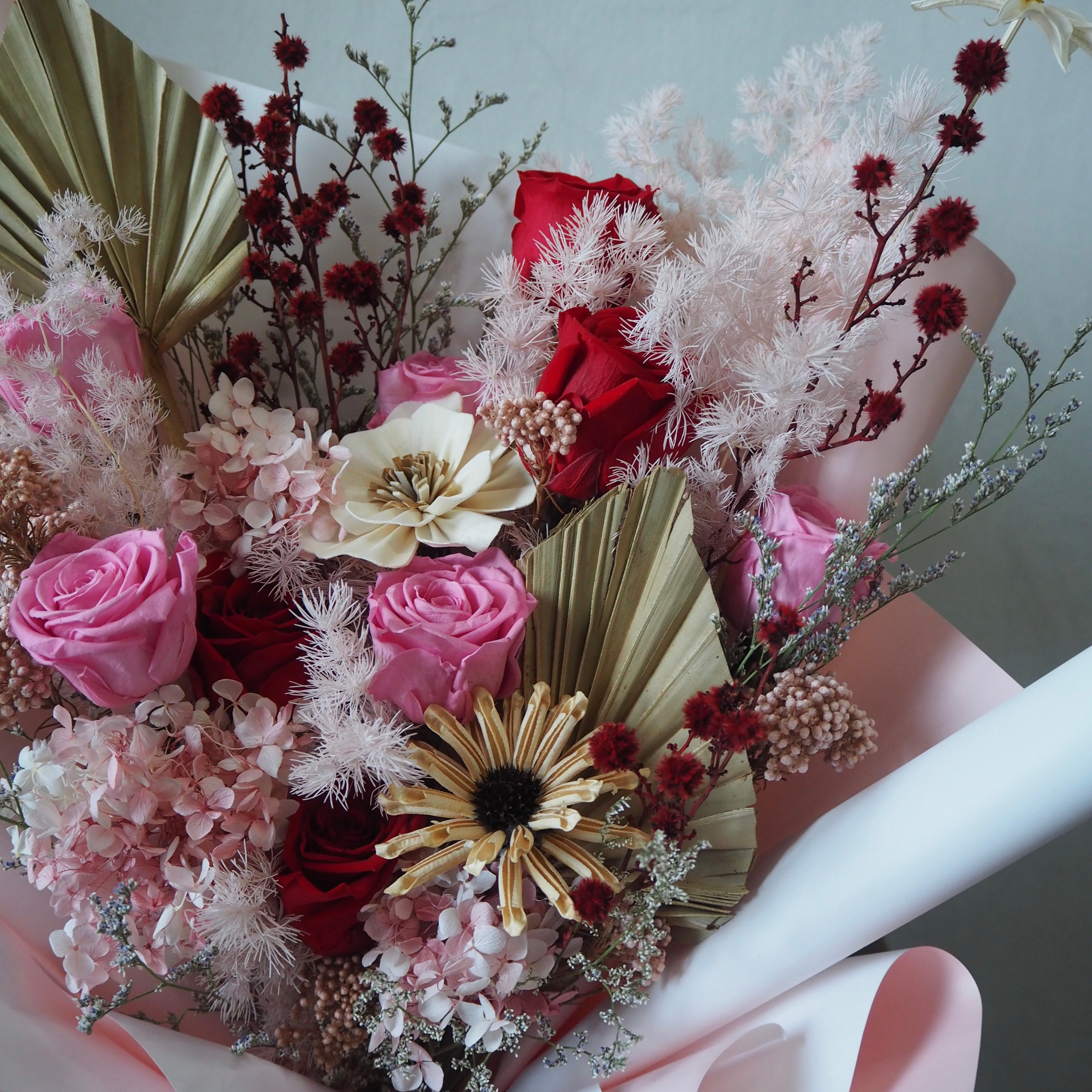 Bouquet of flowers with pink, red, and white colors on a neutral background for valentine flowers same day delivery