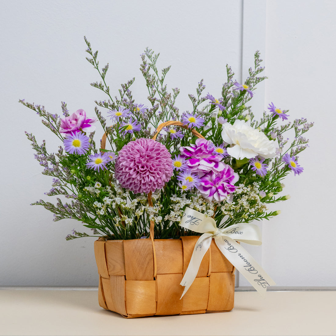 dainty small flower arrangement in purple flowers