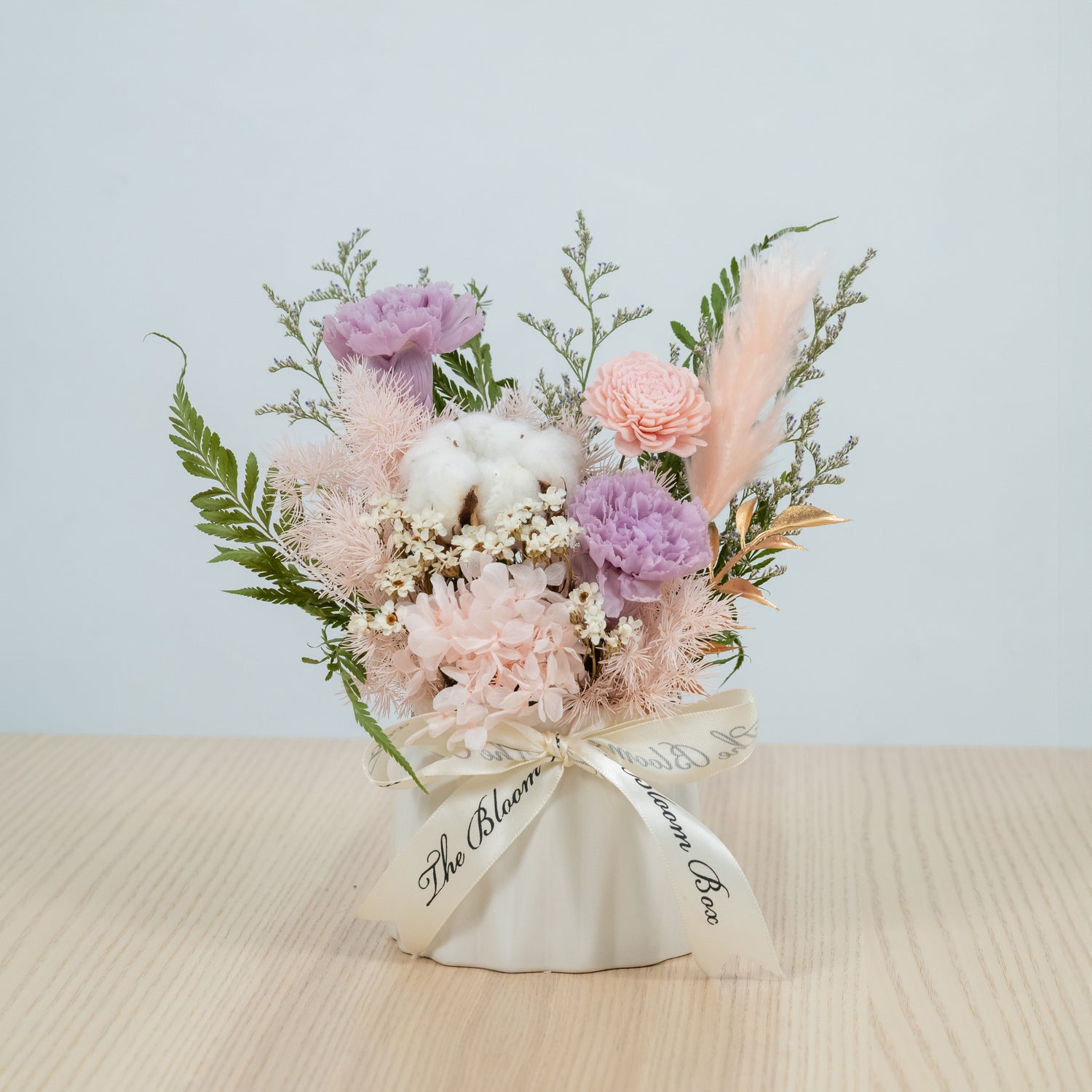 preserved flowers in white vase