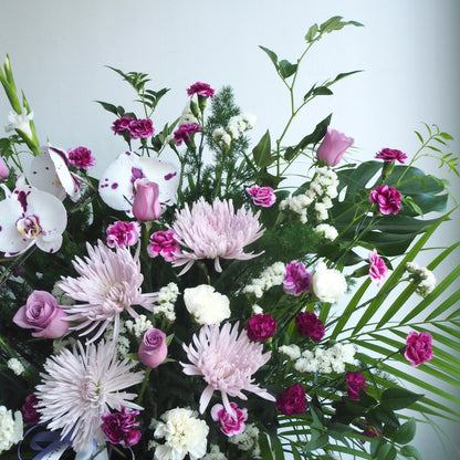purple orchid funeral flowers close up