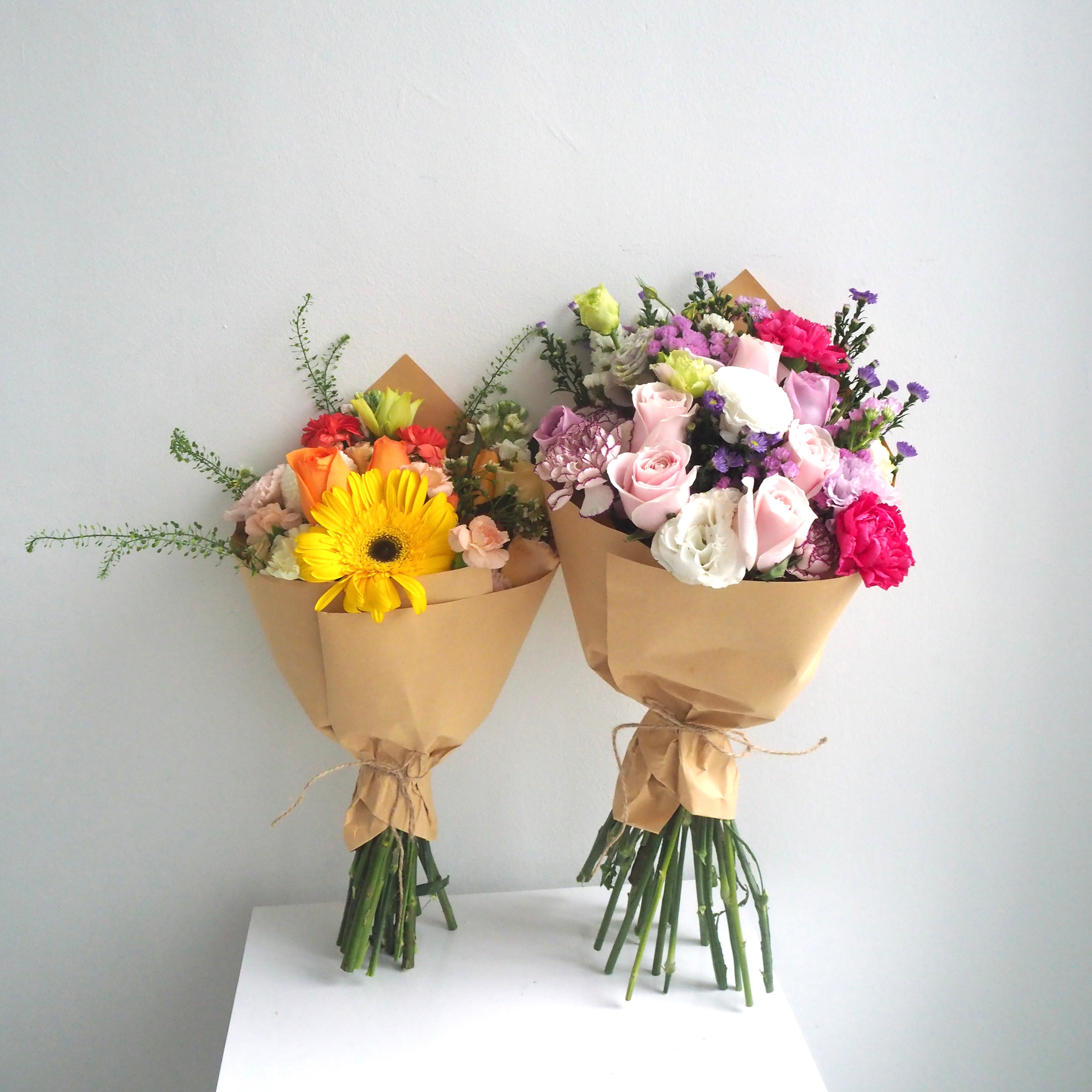 Two fresh flower bouquet side by side