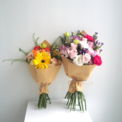 Two fresh flower bouquet side by side