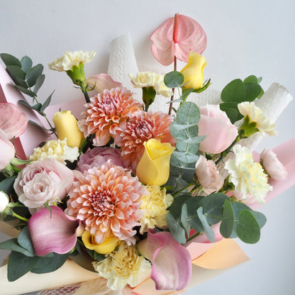 Close-up of premium fresh flowers in Sorbet bouquet with honeycomb wrapping