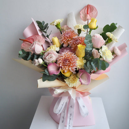 Calla Lily Dahlia fresh flower bouquet wrapped in pink and white paper for birthday flowers