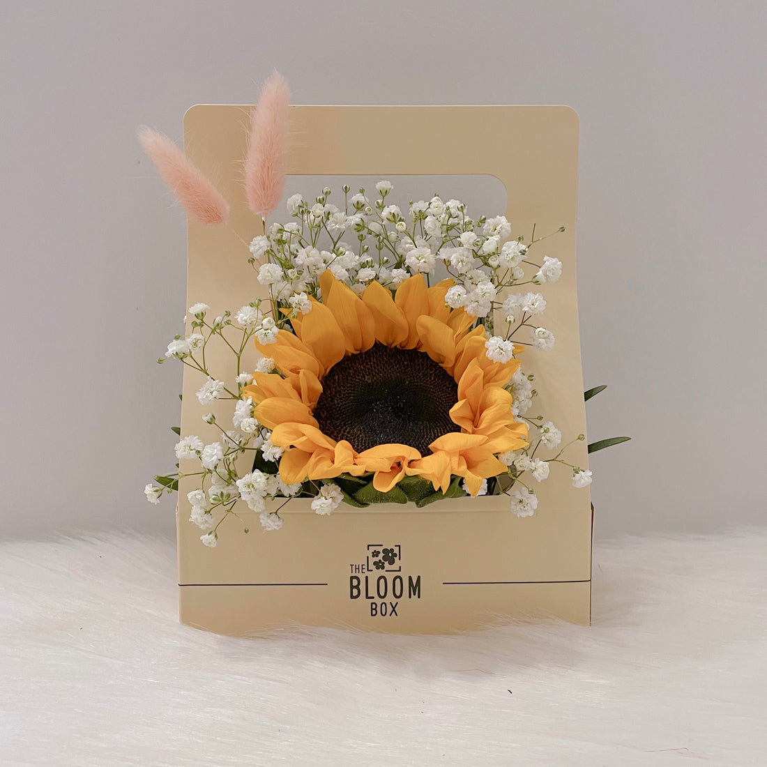 sunflower in centre surrounding with baby breath flowers