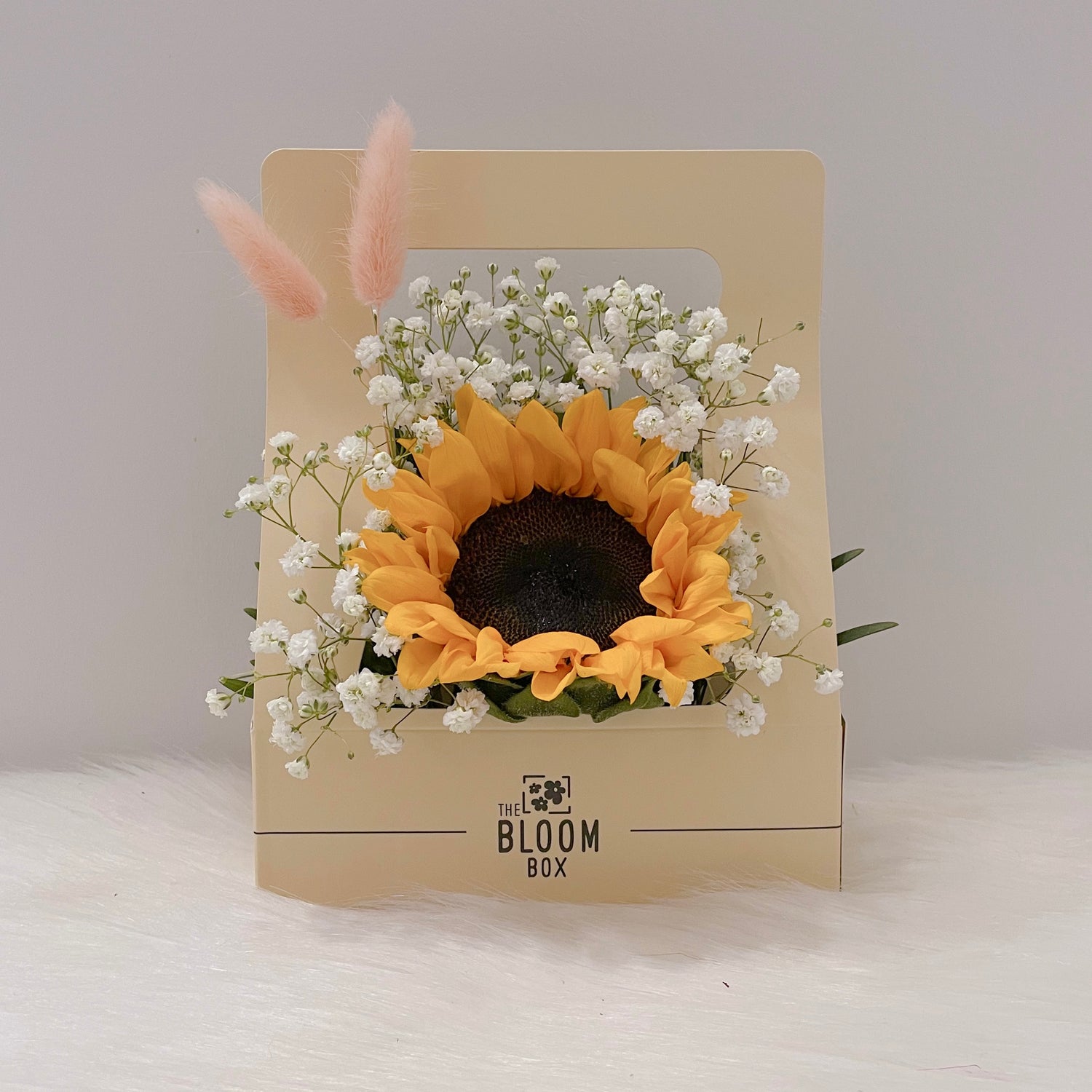 sunflower in centre surrounding with baby breath flowers