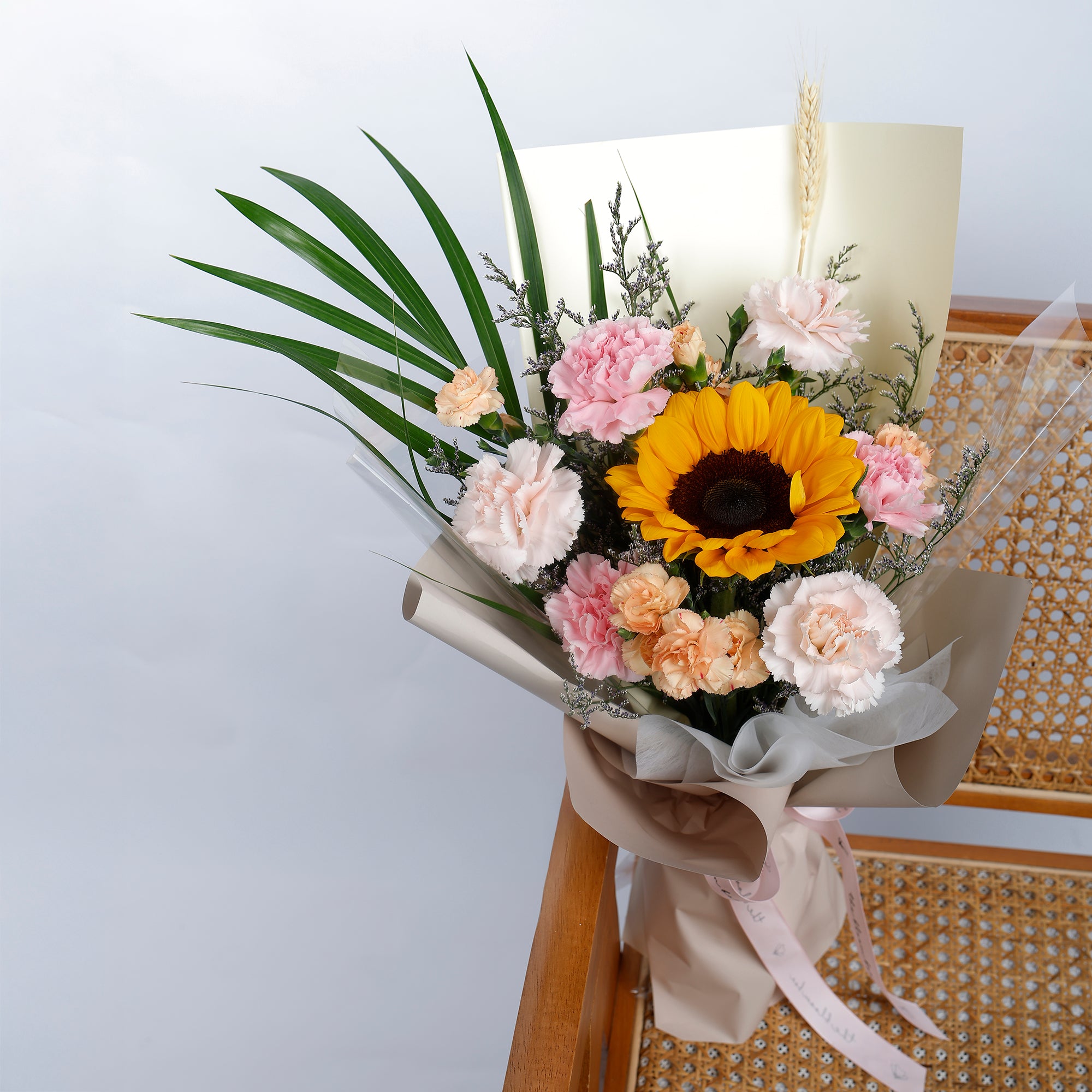 Bouquet of flowers with a sunflower on a white background