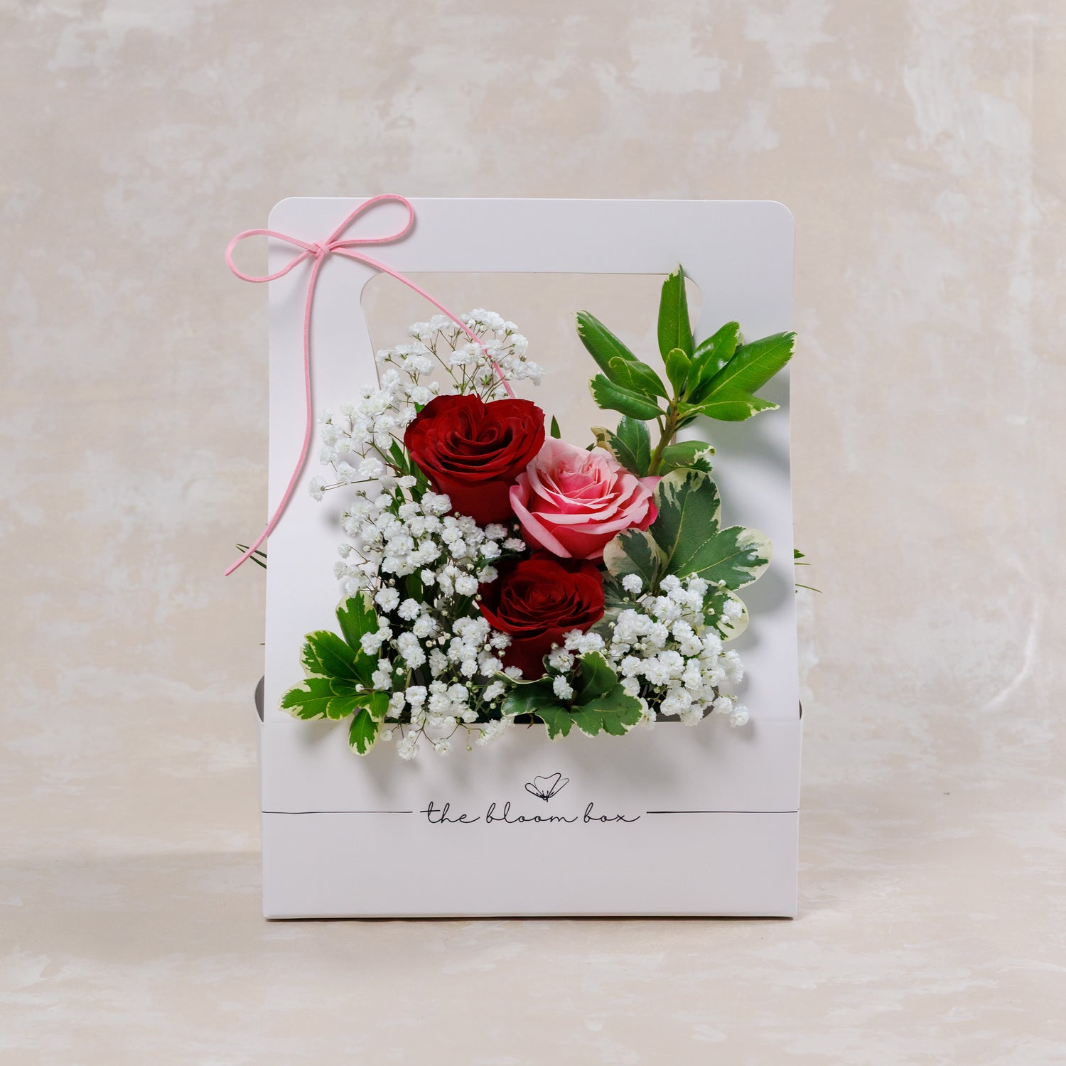 Floral arrangement on a card with &