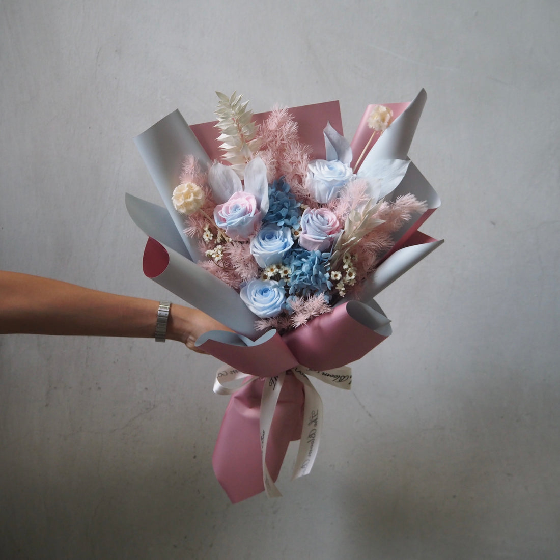 dual pink and blue roses bouquet