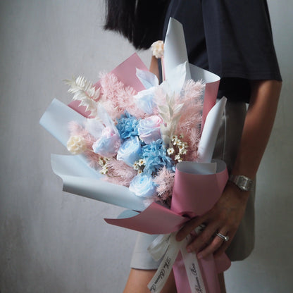 pink moss with blue roses bouquet